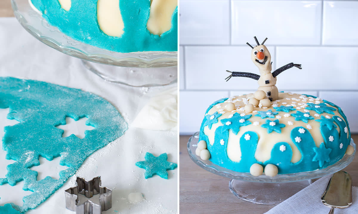 Hjemmelaget Frost-kake pyntet med hvit og blå marsipan, og en Olaf-figur i marsipan på toppen.